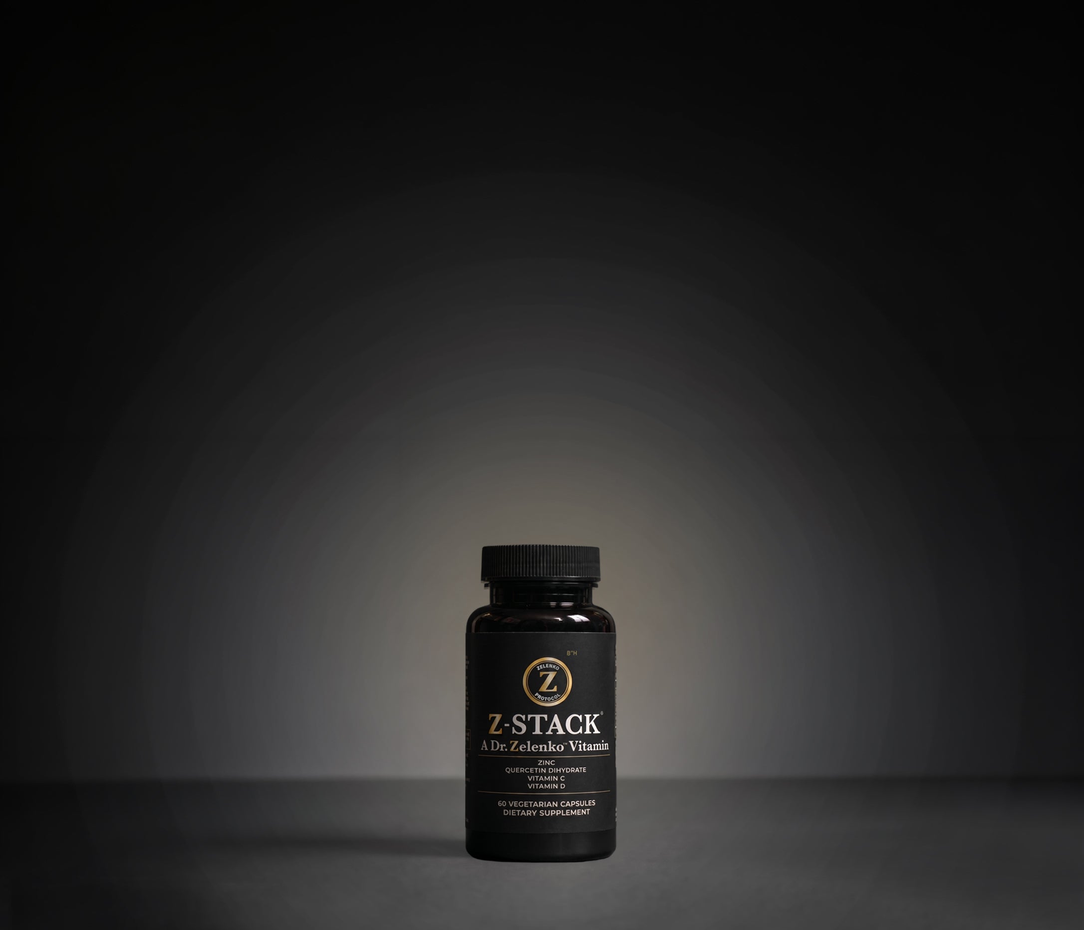 Black bottle labeled Z-Stack immune supplement on a dark background with five-star rating text.
